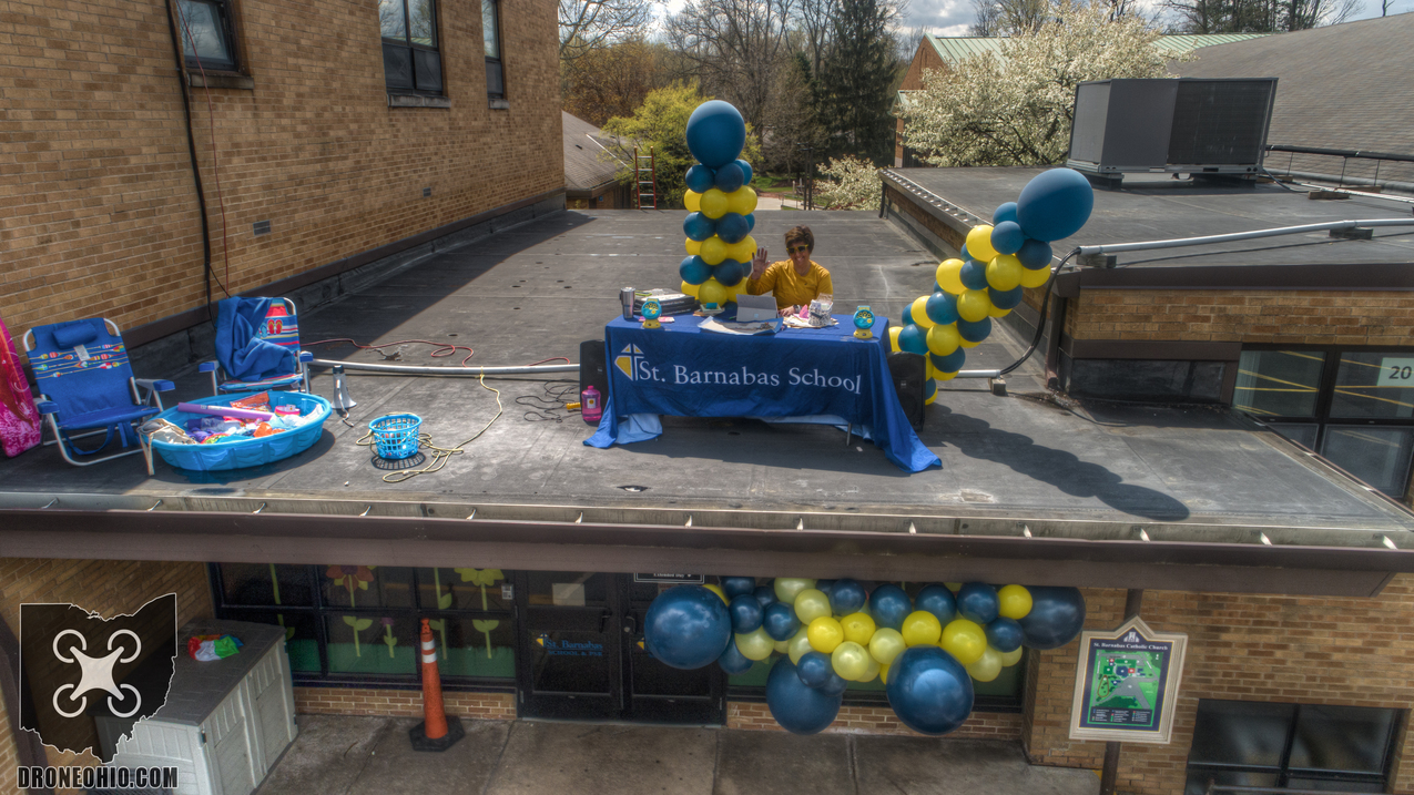 St. Barnabas School principal heads to the roof to fulfill a bargain with students