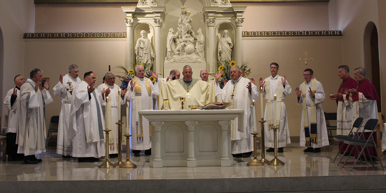 Faithful jam Holy Rosary Church for Mass as the feast of the Assumption celebration begins