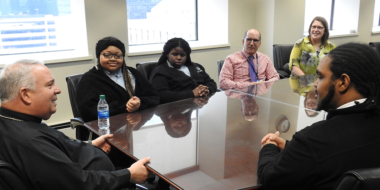 St. Martin de Porres High School diocesan work-study interns spend lunch hour with Archbishop-designate Perez 