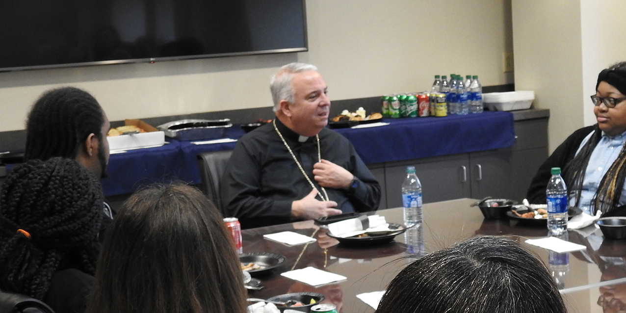 St. Martin de Porres High School diocesan work-study interns spend lunch hour with Archbishop-designate Perez 