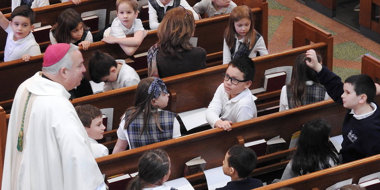 All Saints School celebrates bishop’s visit, basketball title