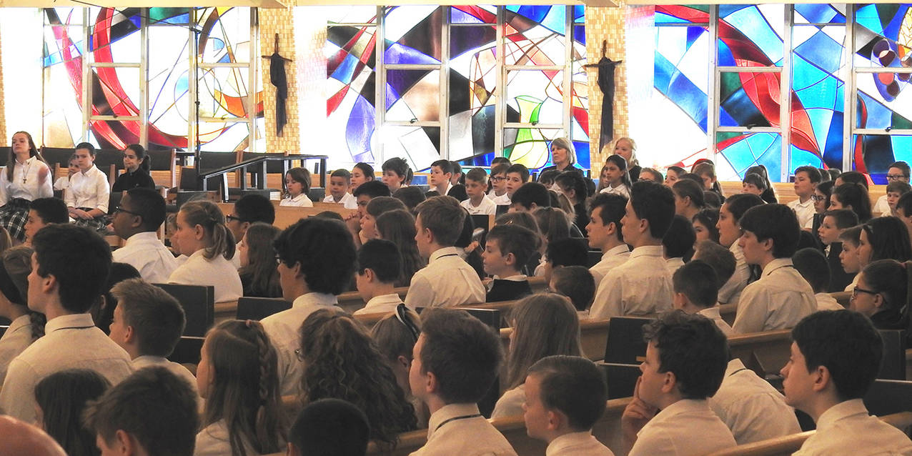 Bishop Perez celebrates Mass, mingles with students at Holy Family School in Stow