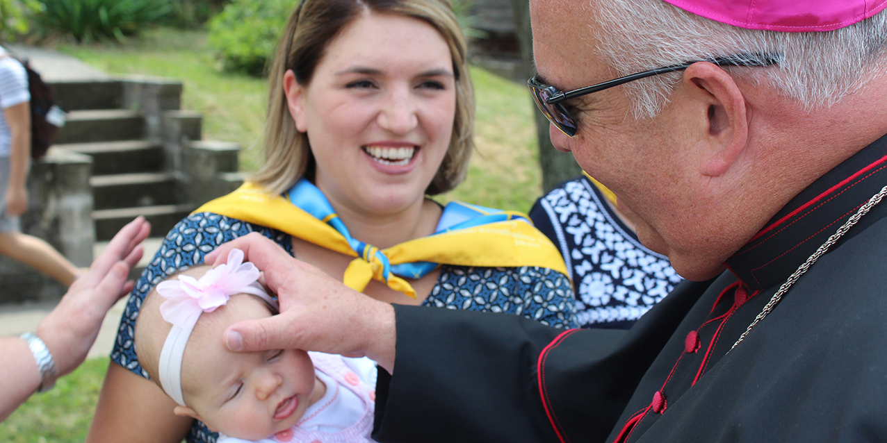Faithful jam Holy Rosary Church for Mass as the feast of the Assumption celebration begins