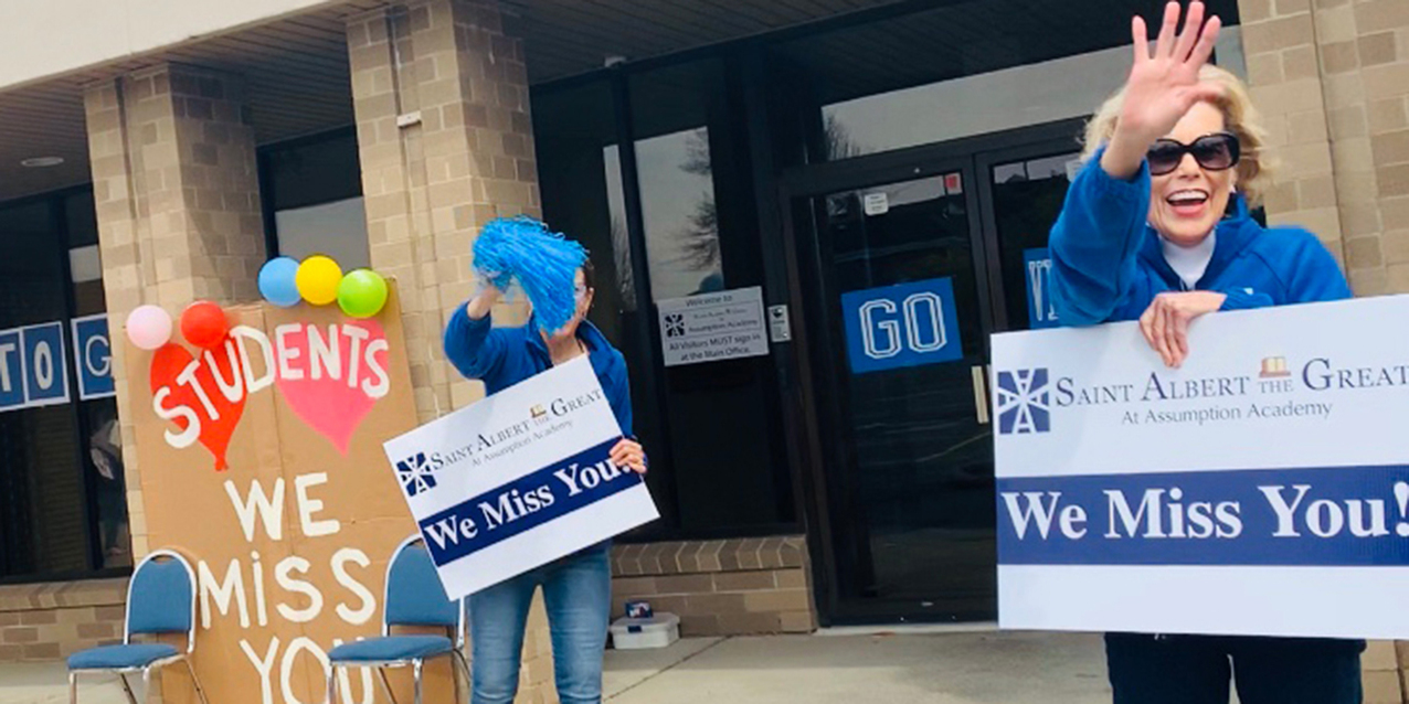 Drive-through spirit rally peps up St. Albert the Great at Assumption Academy community